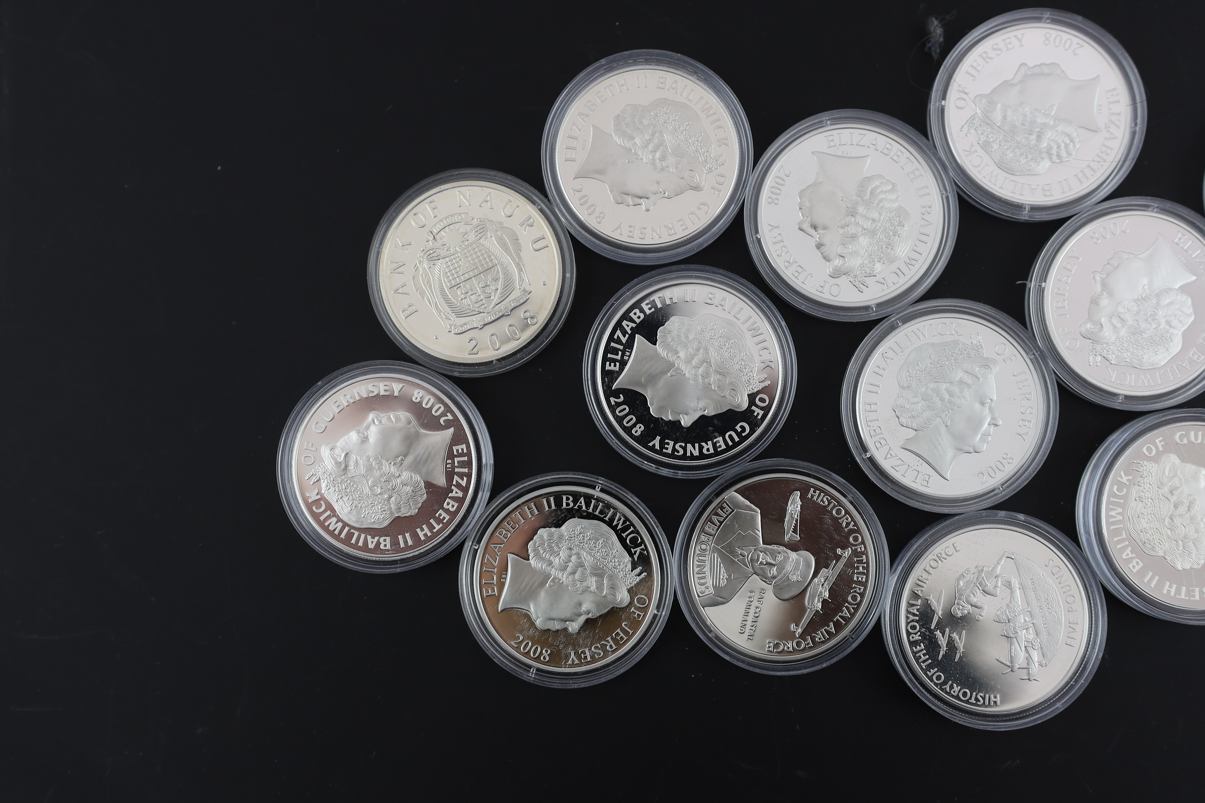 Bailiwick of Jersey and Guernsey coins, Elizabeth II, 13 History of the RAF proof silver £5 coins, 2008, a similar cupronickel coin and a Tristan da Cunha proof silver 80th anniversary Spitfire £1 coin (15)